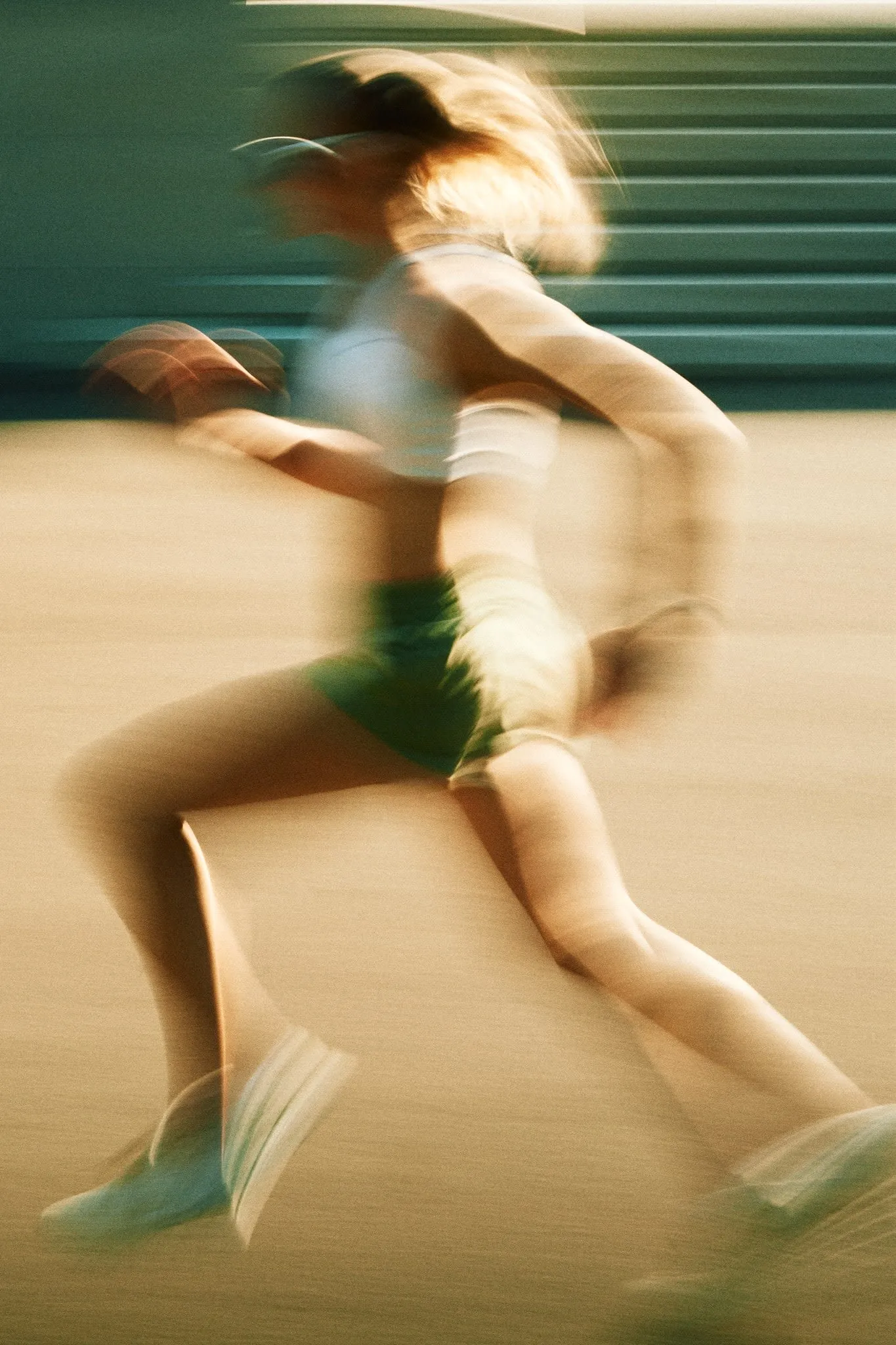 Detail shot of ON shoes worn by a female model, styled with sleek, minimal activewear captured in slow shutter.