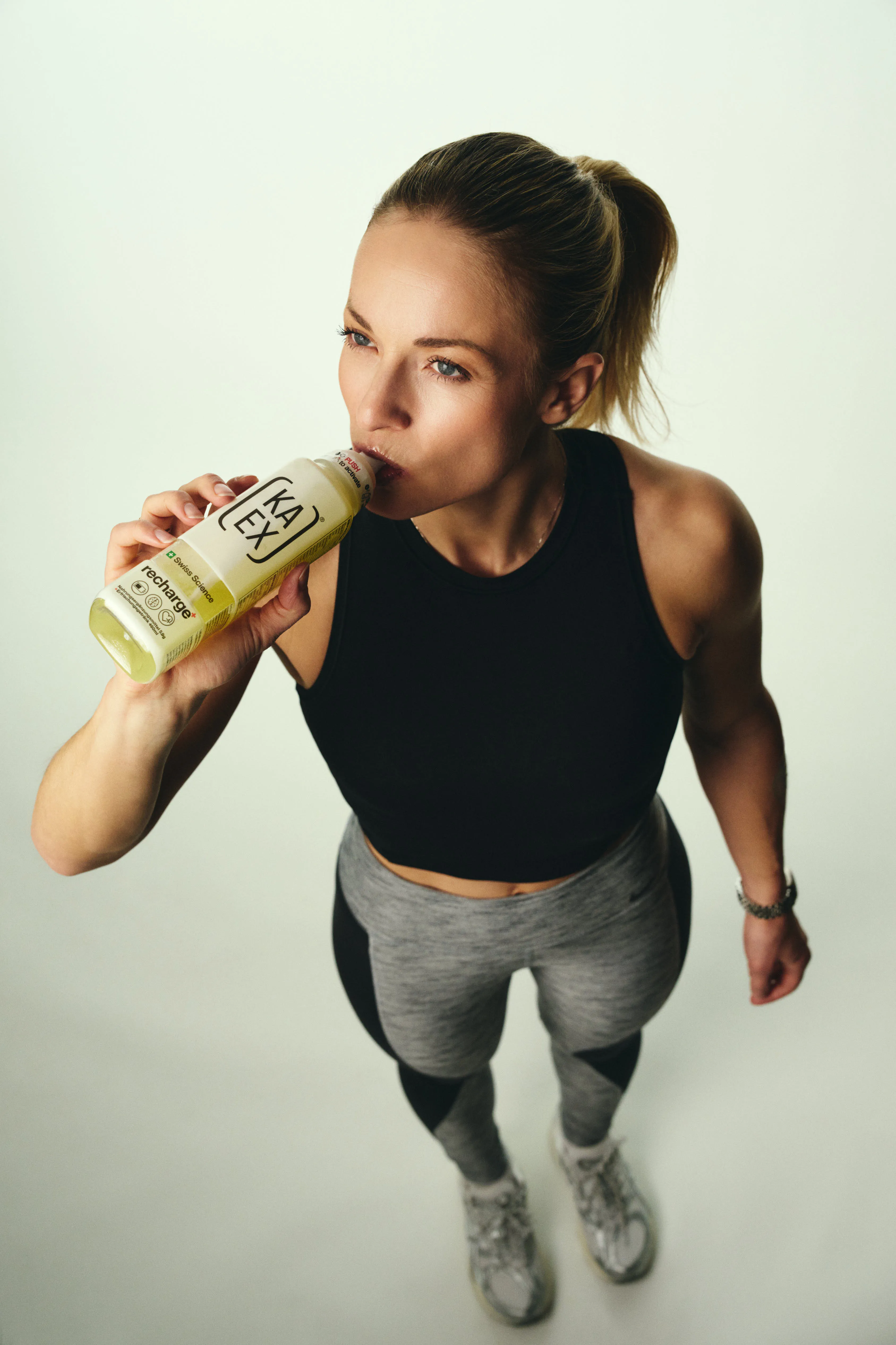 Lara Gut Behrami drinks from a KaEx Recharge Bottle. 