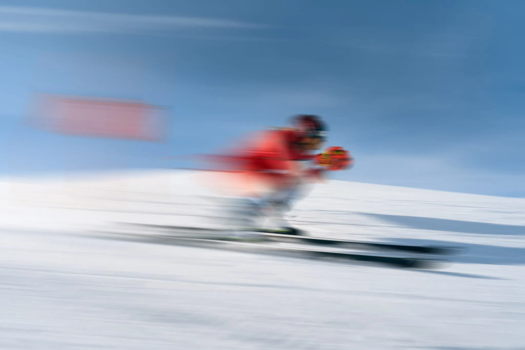 Portrait of Corinne Suter, Swiss Alpine ski racer and Olympic champion, captured in natural light with a serene mountain backdrop, exuding strength and grace.